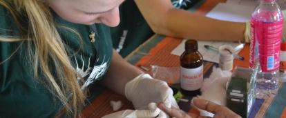 A female intern from Projects Abroad is pictured carrying out blood sugar tests at a screening centre whilst on her public health work experience in Sri Lanka. An intern gaining valuable work experience whilst taking blood sugar tests during her public health internship in Sri Lanka with Projects Abroad.
